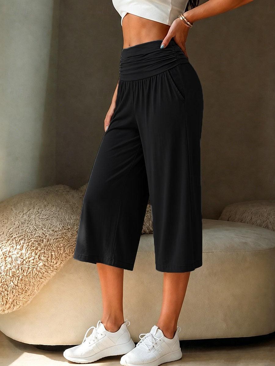 Avslappnade yogabyxor i caprimodell